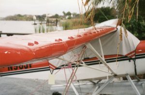Champ Champion 7EC on floats with close-up of VGs on Wing.